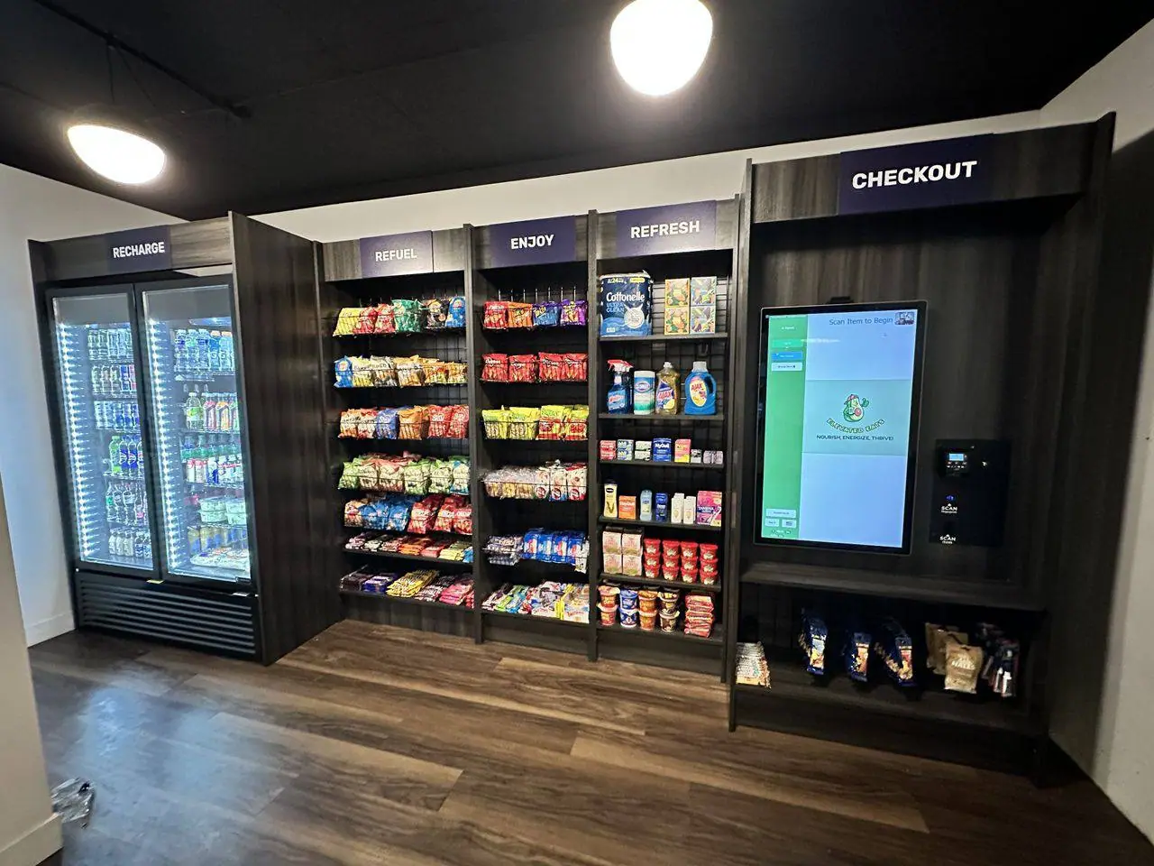 Micro market with shelving, coolers and a kiosk